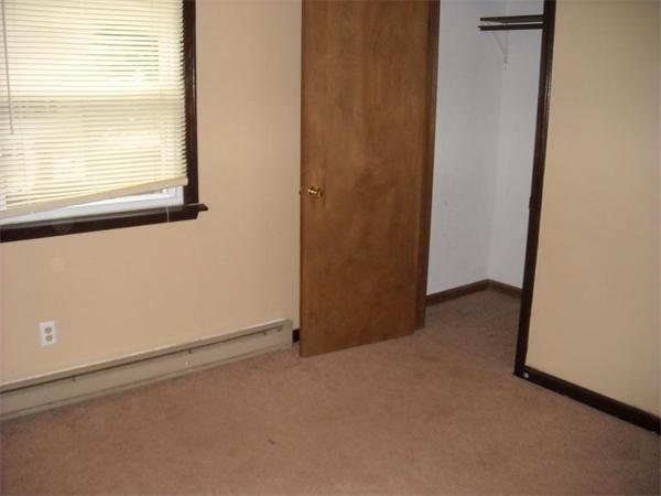 68-70 Howes Street Springfield, MA 01118 - Photo 3 of 7 an empty room with a window