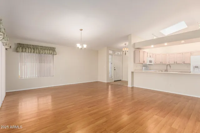 a view of a kitchen with a sink and a window