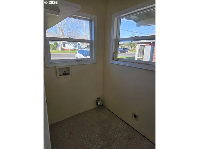 a view of a hallway with a window
