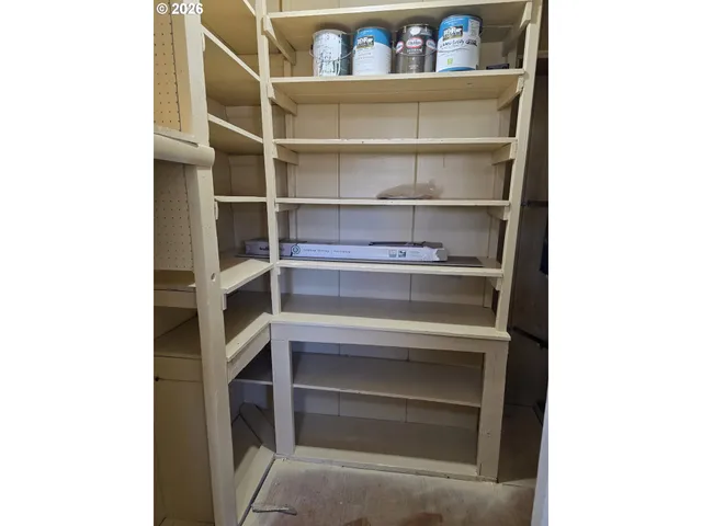 a bathroom with a granite countertop toilet sink and mirror