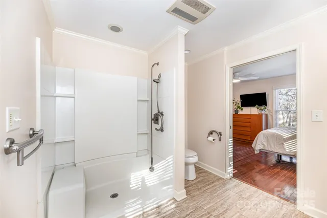 a bathroom with a bathtub and a shower
