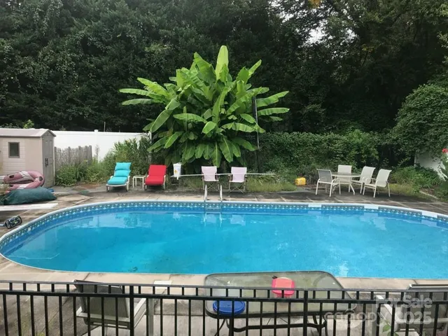 a view of swimming pool from a balcony