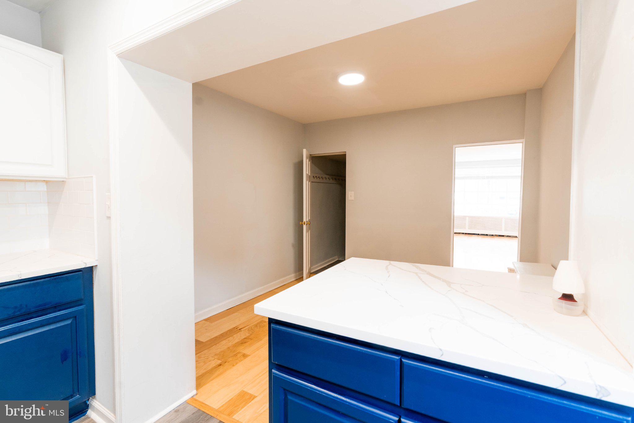 2433 South 3rd Street Philadelphia, PA 19148 - Photo 6 of 25 Modern kitchen with vibrant blue accents.