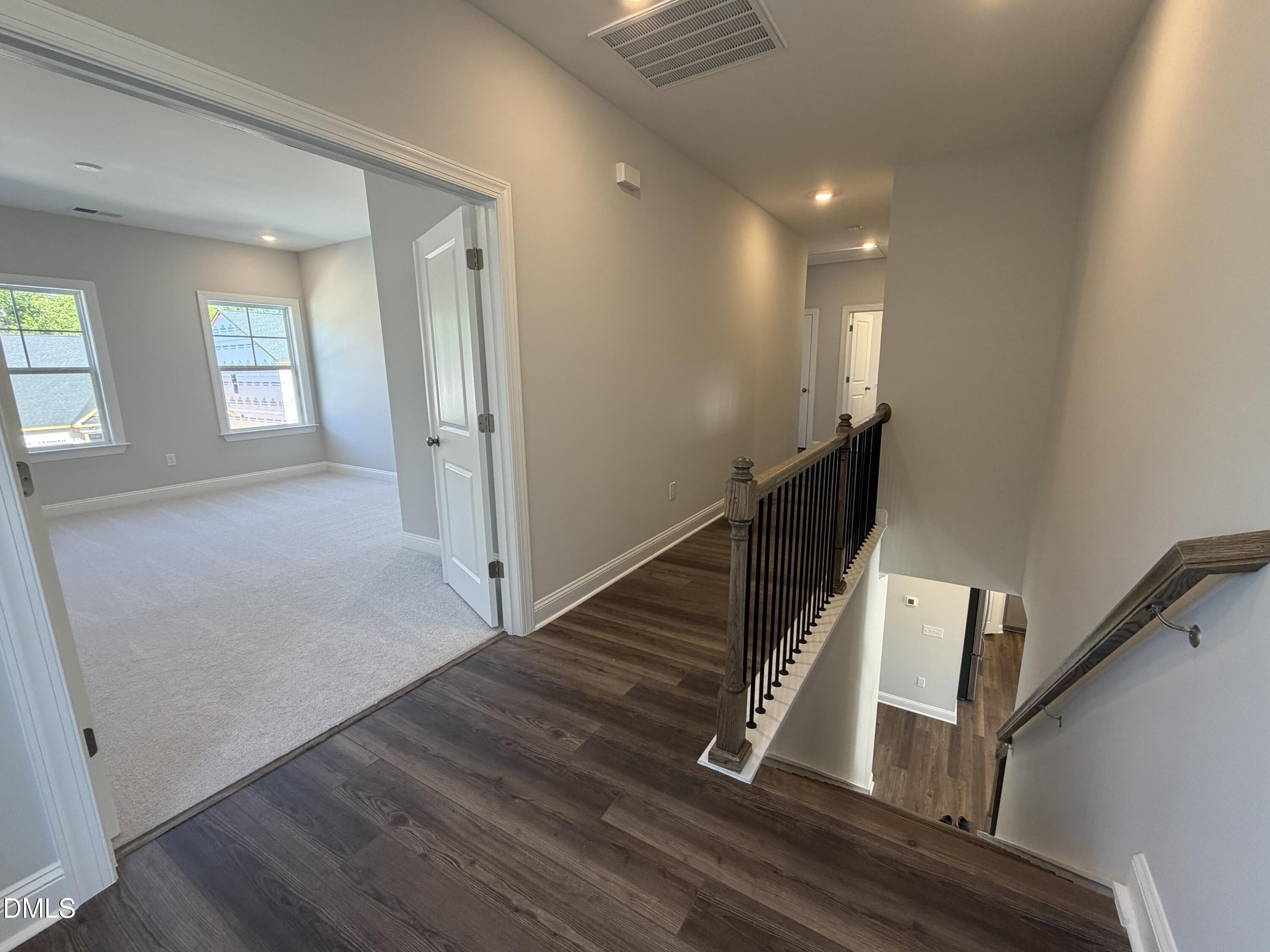 3016 Sandy Bluff Road Raleigh, NC 27616 - Photo 18 of 34 a view of entryway and hall with wooden floor