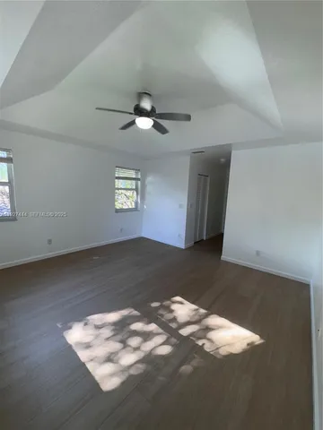an empty room with wooden floor