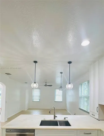 a view of hallway with windows