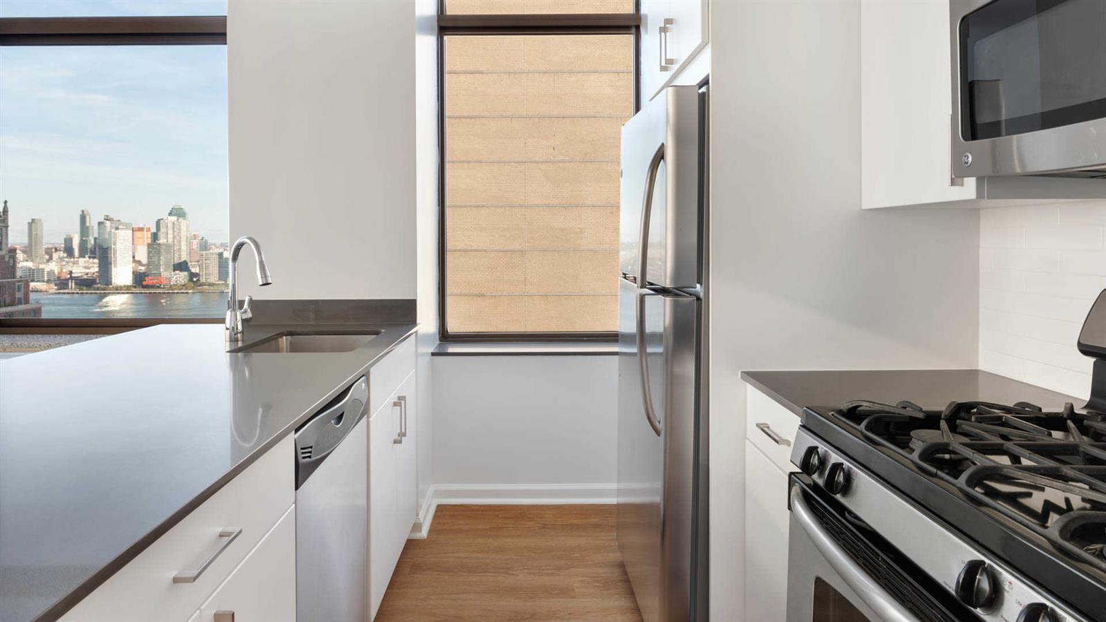 300 East 39th Street, Unit 21E Manhattan, NY 10016 - Photo 4 of 10 a kitchen with a stove and a refrigerator
