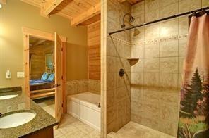 93 Bear Track Trail Morganton, GA 30560 - Photo 7 of 12 a bathroom with a granite countertop shower mirror and a sink