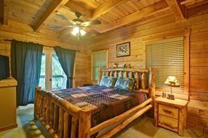 93 Bear Track Trail Morganton, GA 30560 - Photo 9 of 12 a bed sitting in a bedroom next to a window