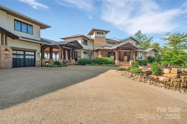 a bathroom with a glass door shower and a toilet