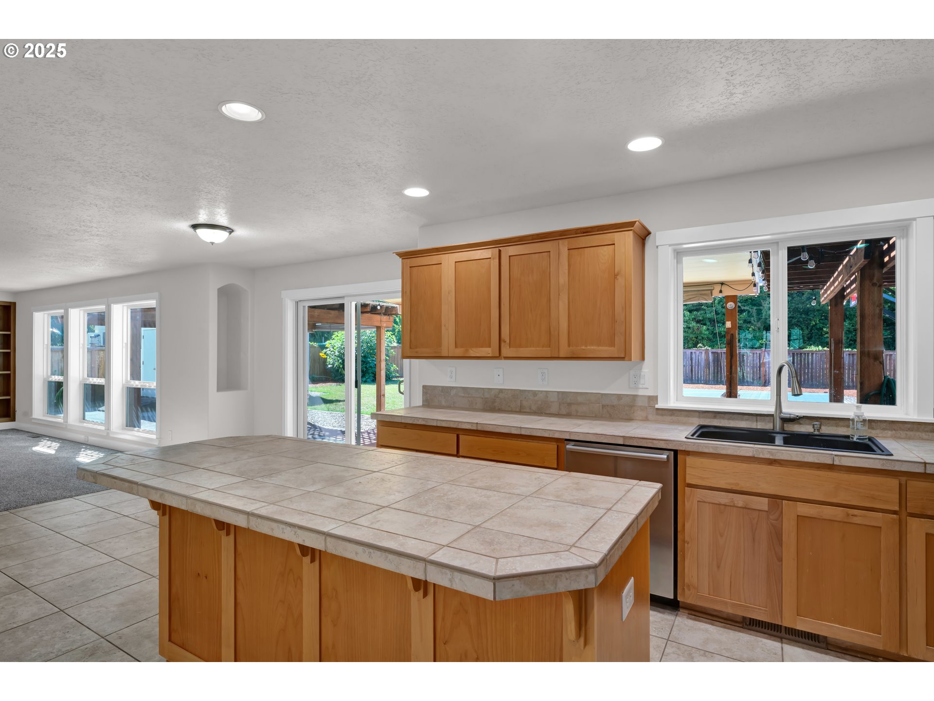 2310 Northwest Gale Street Albany, OR 97321 - Photo 11 of 48 a kitchen with a stove a sink and a wooden cabinets