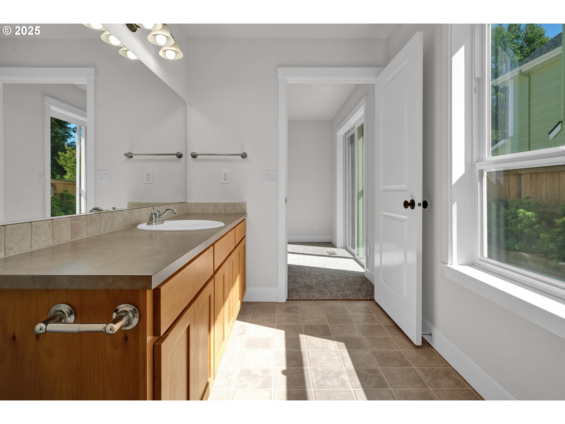 2310 Northwest Gale Street Albany, OR 97321 - Photo 18 of 48 a bathroom with a sink a vanity and a mirror