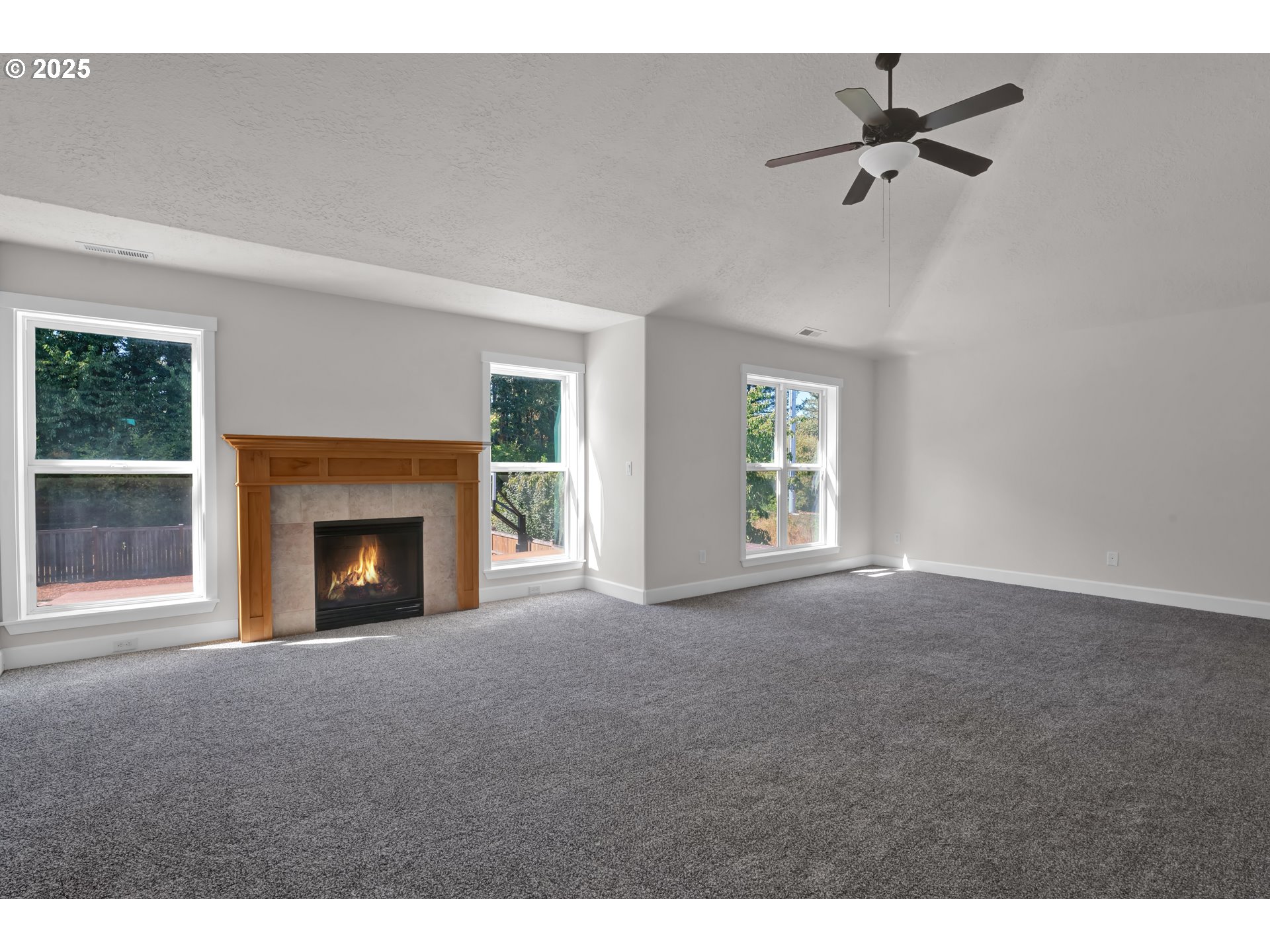 2310 Northwest Gale Street Albany, OR 97321 - Photo 23 of 48 a view of empty room with windows and fireplace