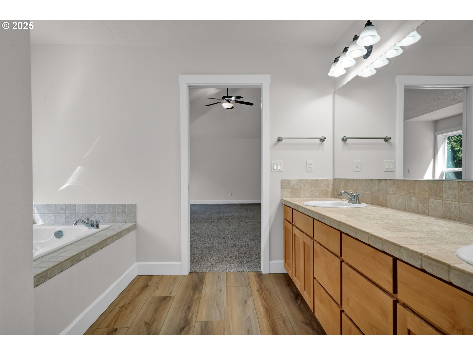 2310 Northwest Gale Street Albany, OR 97321 - Photo 29 of 48 a bathroom with a sink vanity and a mirror