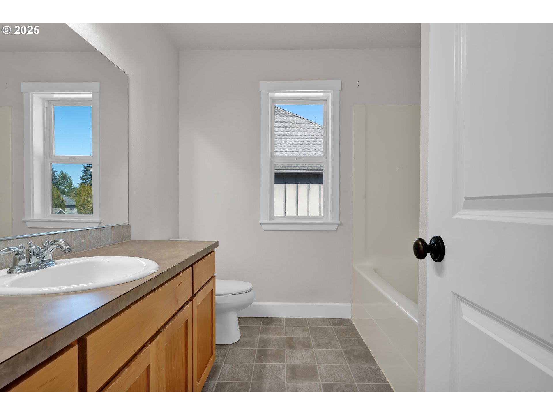 2310 Northwest Gale Street Albany, OR 97321 - Photo 30 of 48 a bathroom with a granite countertop sink a toilet and a mirror