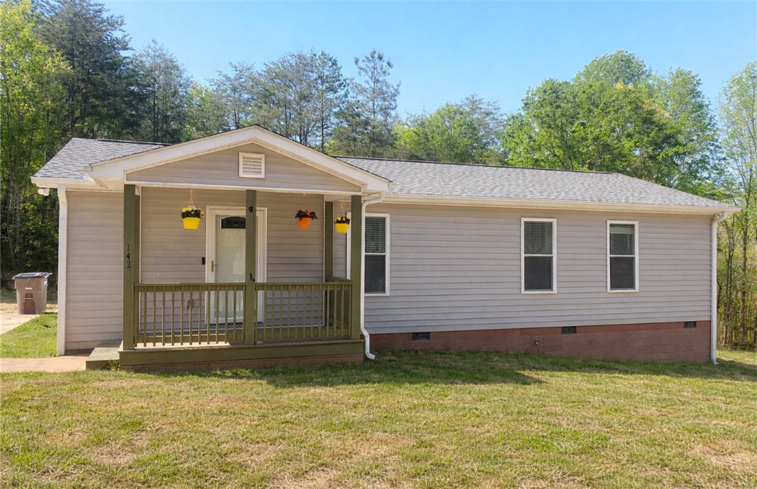 142 Burns Hill Street Liberty, SC 29657 - Photo 1 of 12 This charming residence features a classic front porch, inviting comfortable outdoor living.