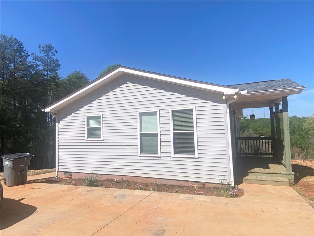142 Burns Hill Street Liberty, SC 29657 - Photo 2 of 12 This charming home offers a serene escape with its inviting front porch.