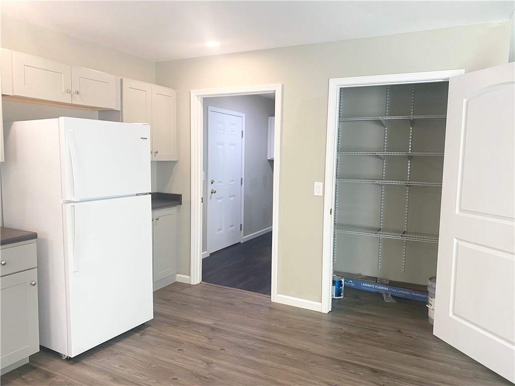 142 Burns Hill Street Liberty, SC 29657 - Photo 5 of 12 This thoughtfully designed kitchen boasts efficient storage solutions and durable flooring for everyday living.