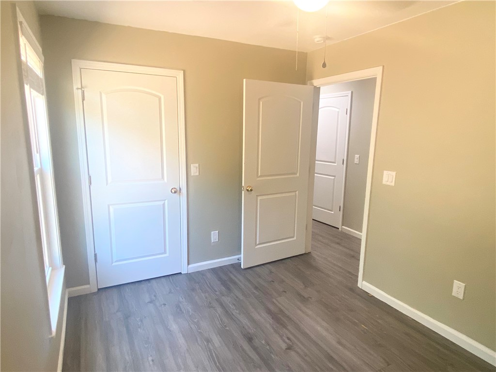 142 Burns Hill Street Liberty, SC 29657 - Photo 7 of 12 This inviting space features durable flooring and ample natural light, creating a comfortable atmosphere.
