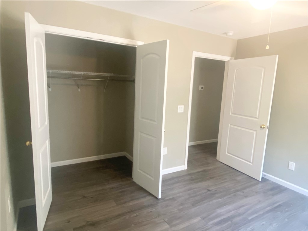 142 Burns Hill Street Liberty, SC 29657 - Photo 9 of 12 This cozy bedroom offers a spacious closet and durable flooring for comfortable living.