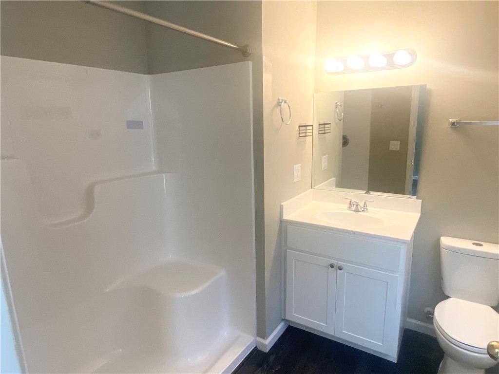 142 Burns Hill Street Liberty, SC 29657 - Photo 10 of 12 This bathroom features a contemporary vanity and a practical shower, perfect for everyday routines.