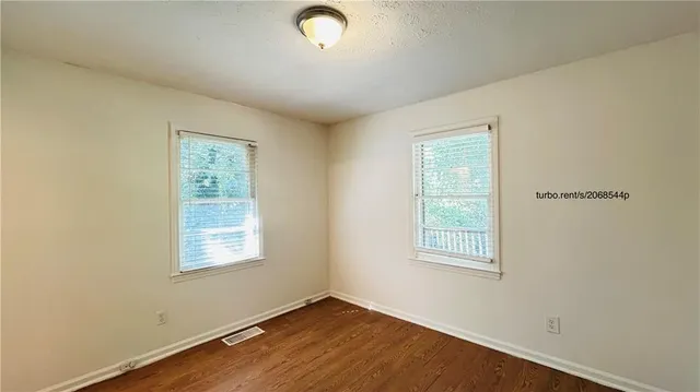 an empty room with windows