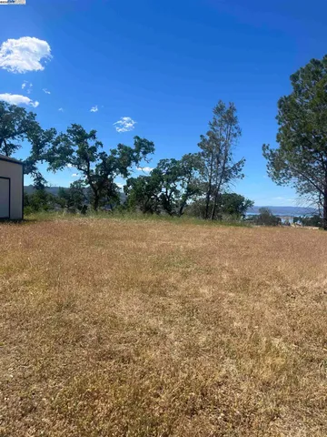 a view of a lake with a house in the background