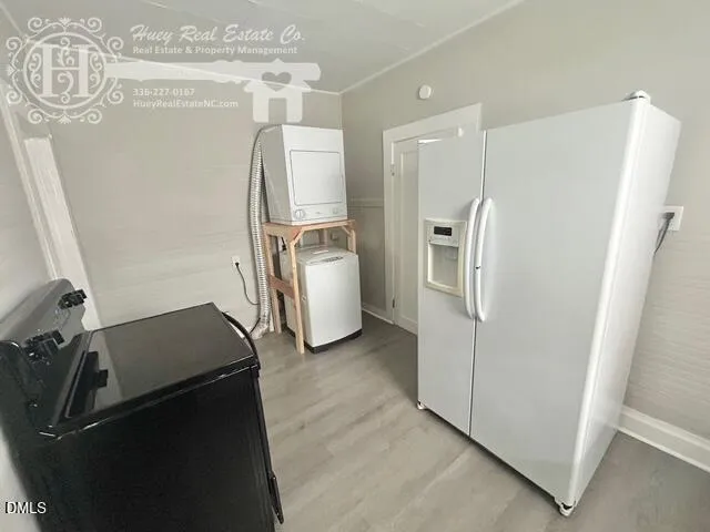 a view of a refrigerator and utility room