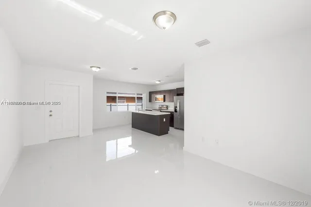a view of a kitchen with a sink