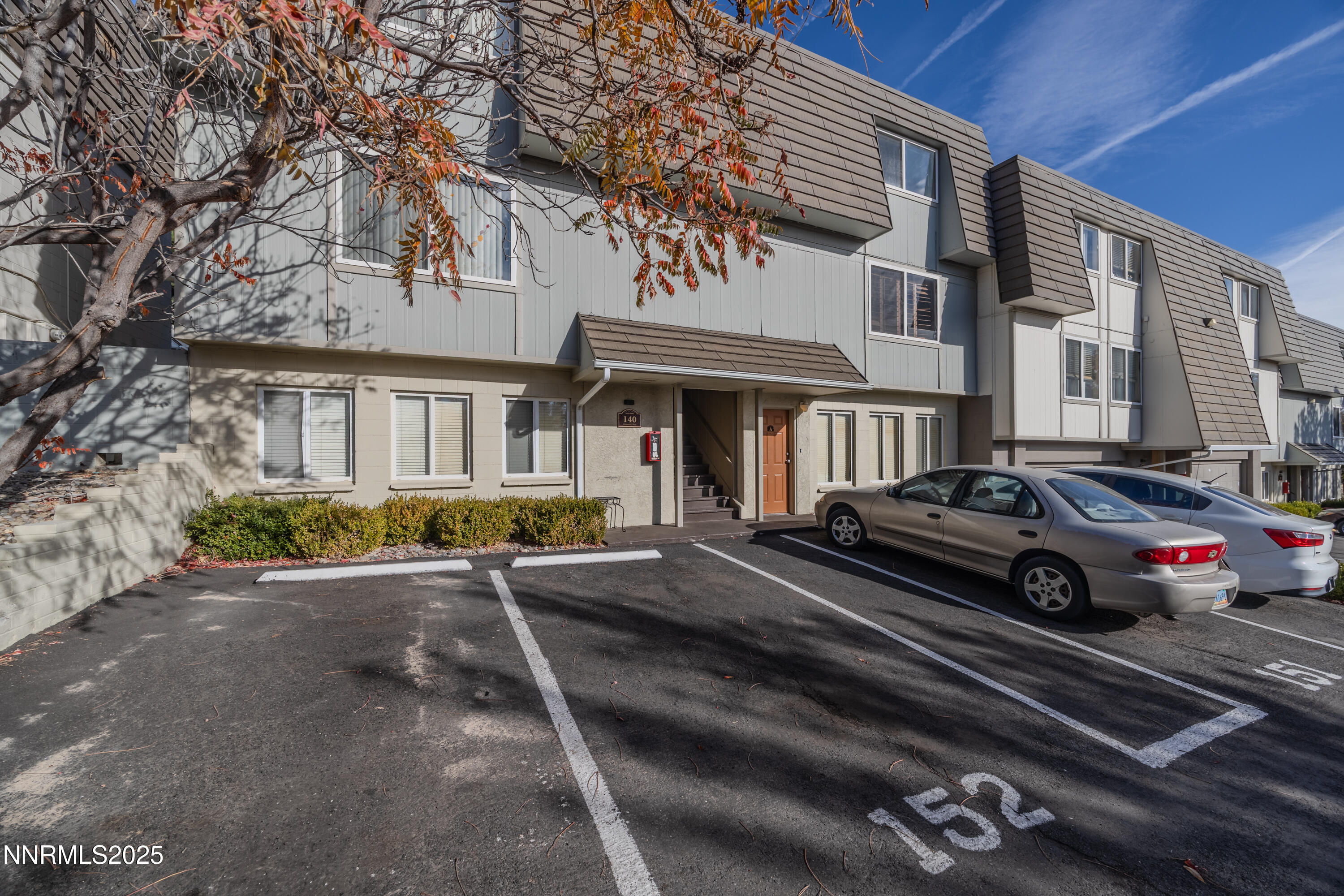 140 Griswold Way, Unit C Reno, NV 89503 - Photo 1 of 17 a view of a car park in front of a house