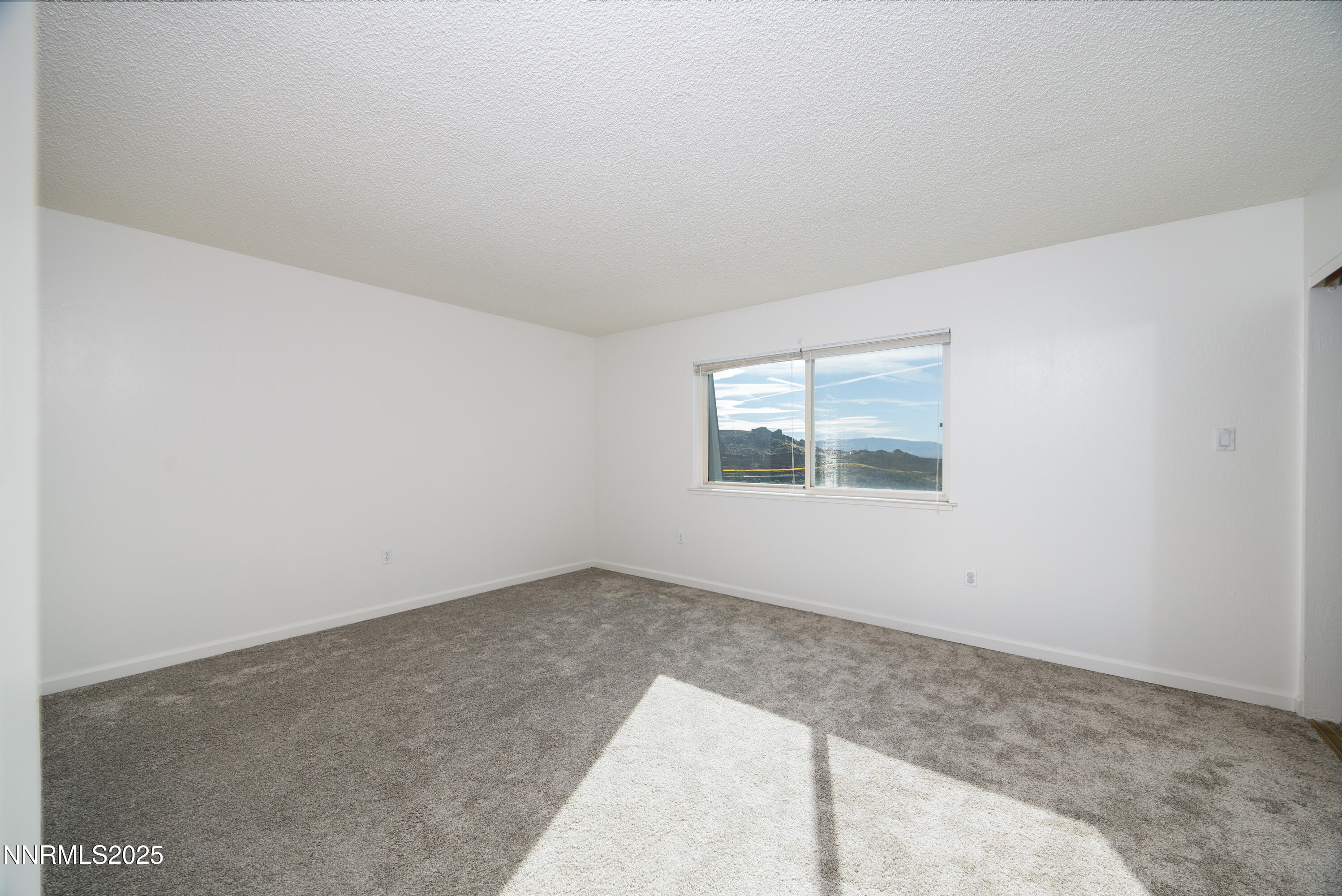 140 Griswold Way, Unit C Reno, NV 89503 - Photo 11 of 17 an empty room with windows