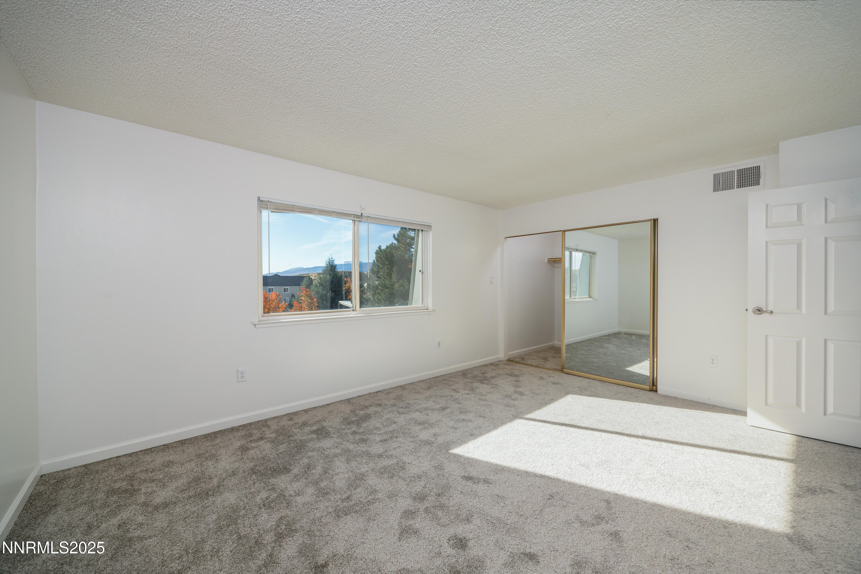 140 Griswold Way, Unit C Reno, NV 89503 - Photo 12 of 17 an empty room with windows