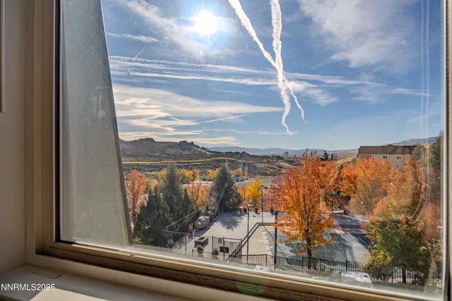 a view of a glass door and a window