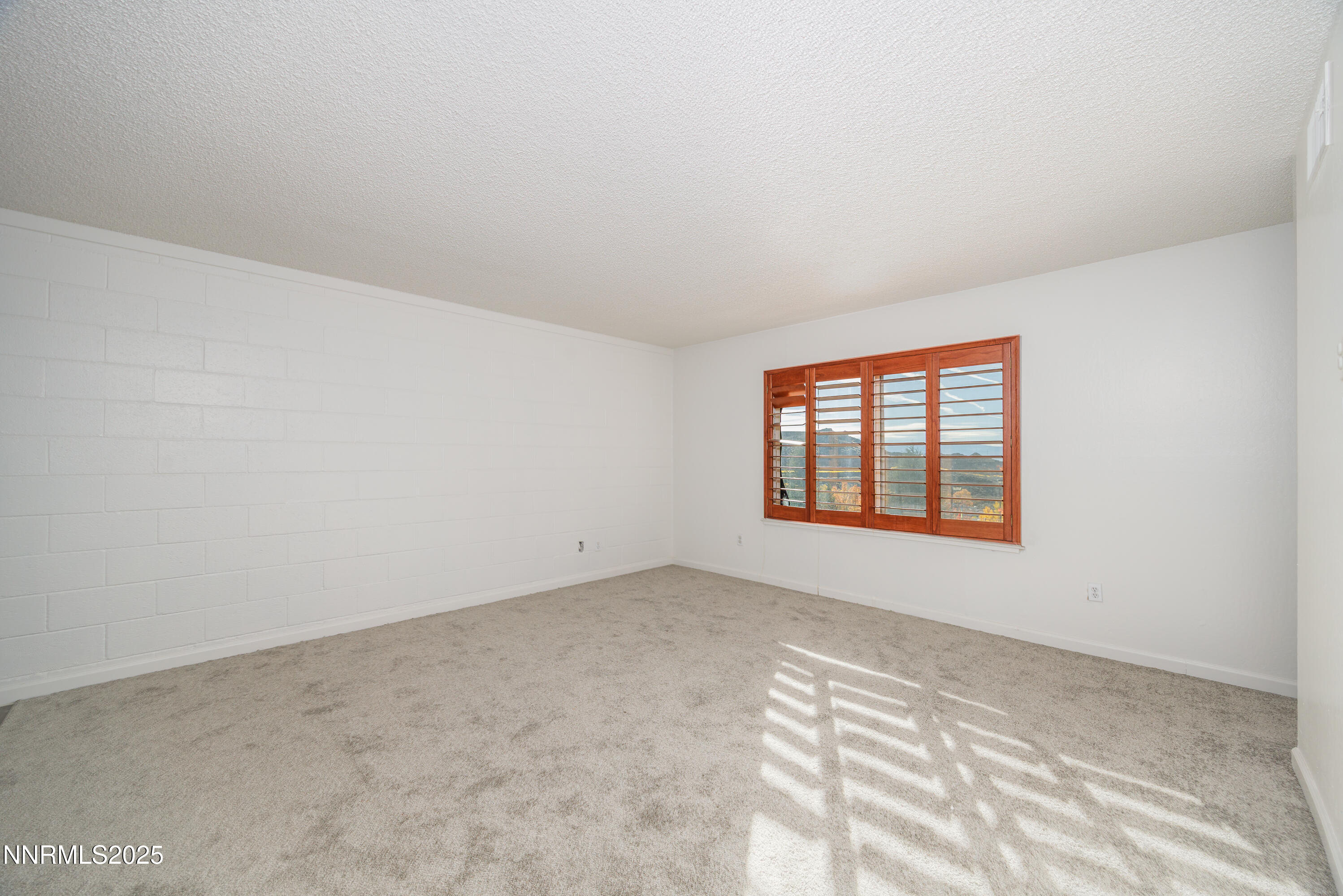 140 Griswold Way, Unit C Reno, NV 89503 - Photo 5 of 17 an empty room with a window
