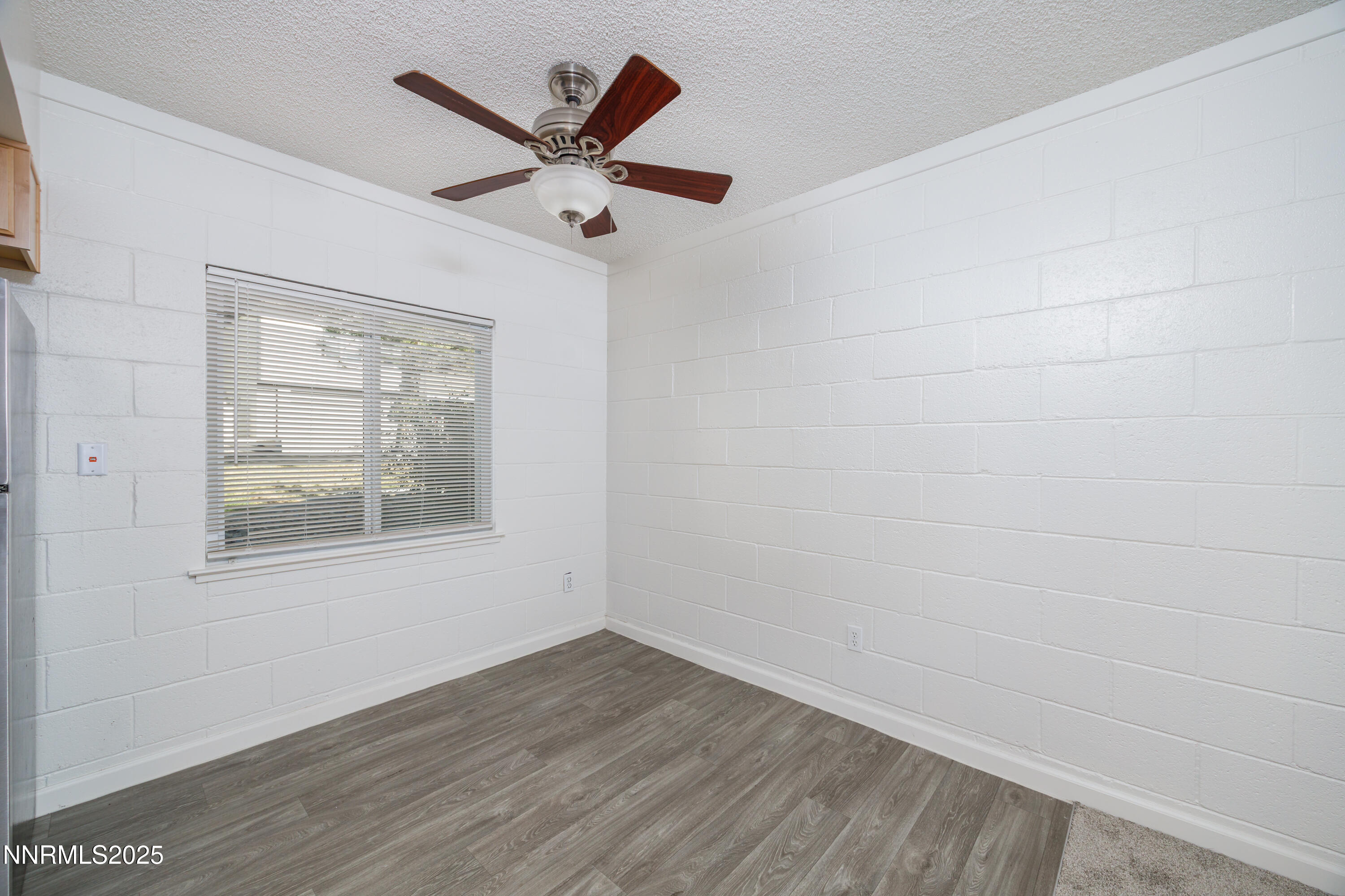 140 Griswold Way, Unit C Reno, NV 89503 - Photo 6 of 17 wooden floor in an empty room with a window