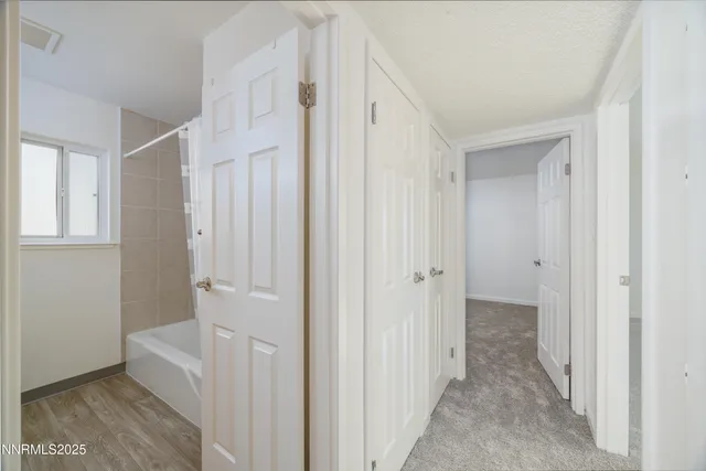 a view of a bathroom with a sink and mirror