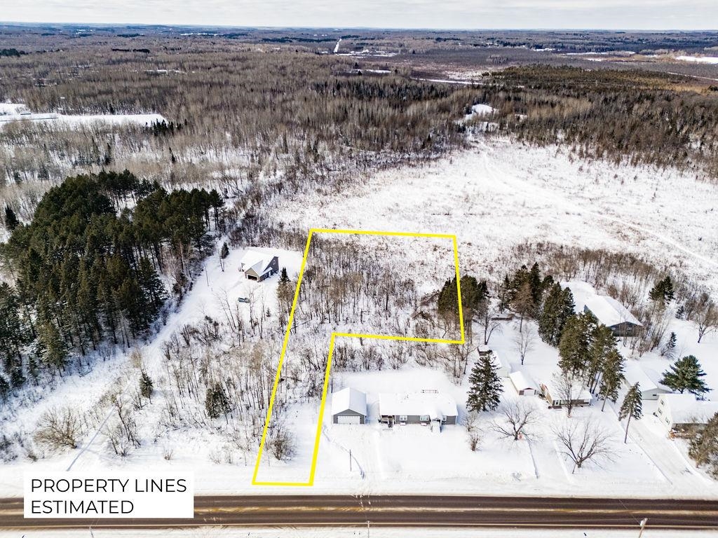 44-xx Ugstad Road Hermantown, MN 55811 - Photo 5 of 8 Snowy aerial view with property parcel outlined and a forest view