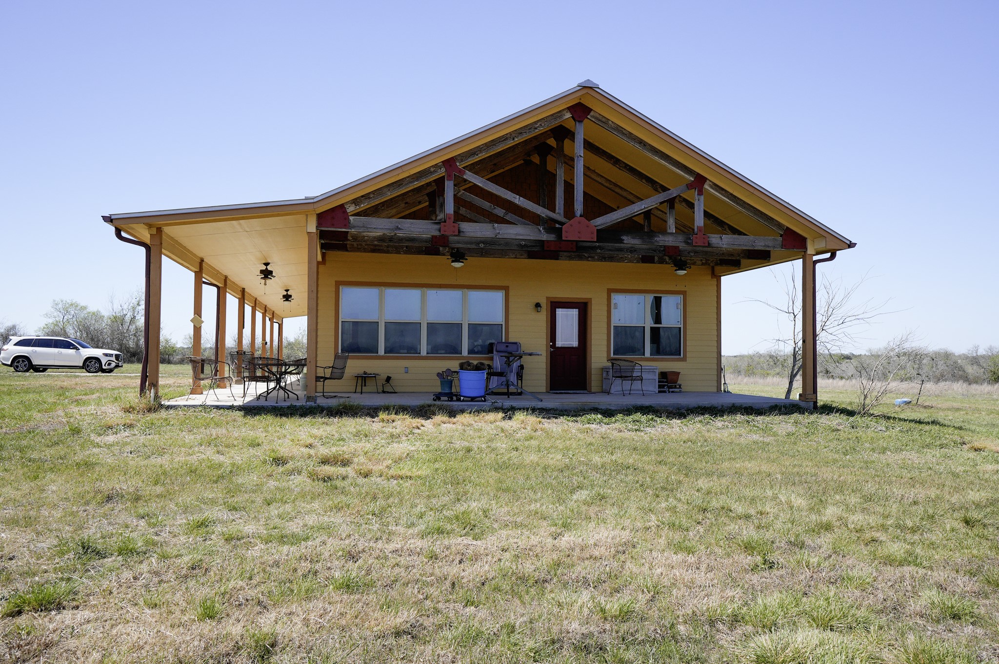 a view of a house with swimming pool and sitting area