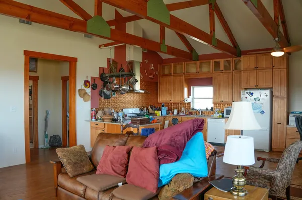 a living room with lots of furniture and a chandelier