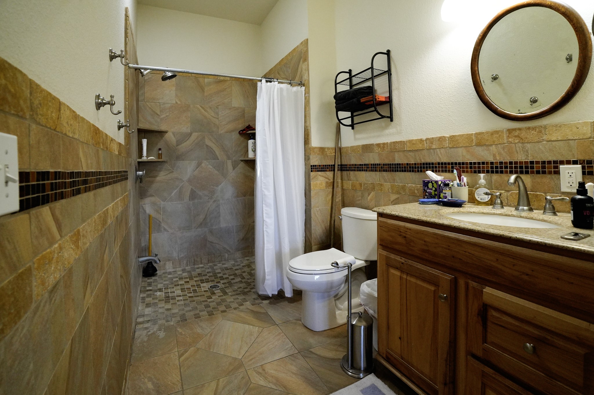 6455 Gebert Road Muldoon, TX 78949 - Photo 11 of 44 a bathroom with a toilet a sink and shower