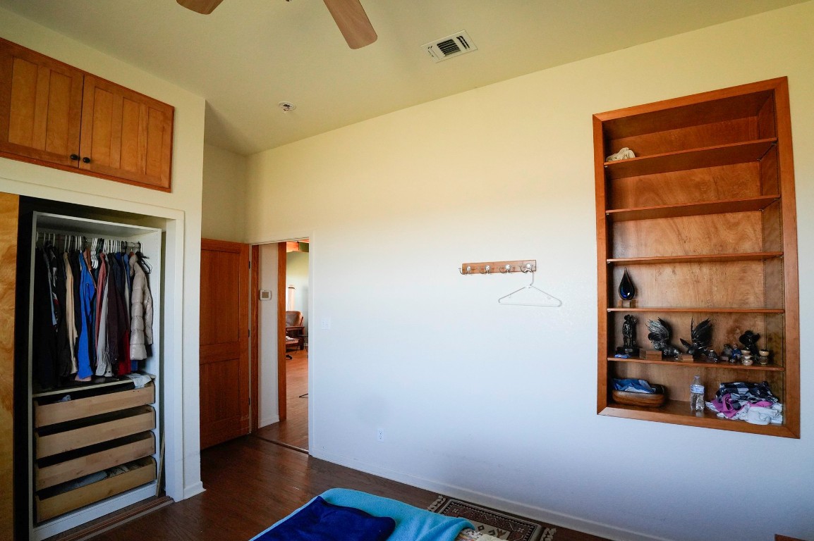 6455 Gebert Road Muldoon, TX 78949 - Photo 13 of 44 a view of a hallway with wooden shelves