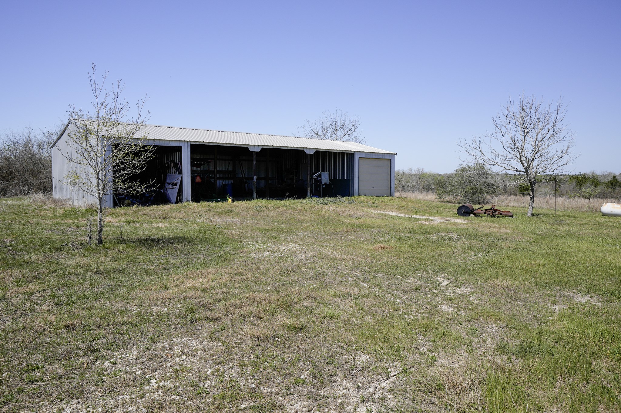 6455 Gebert Road Muldoon, TX 78949 - Photo 19 of 44 a front view of house with yard and trees