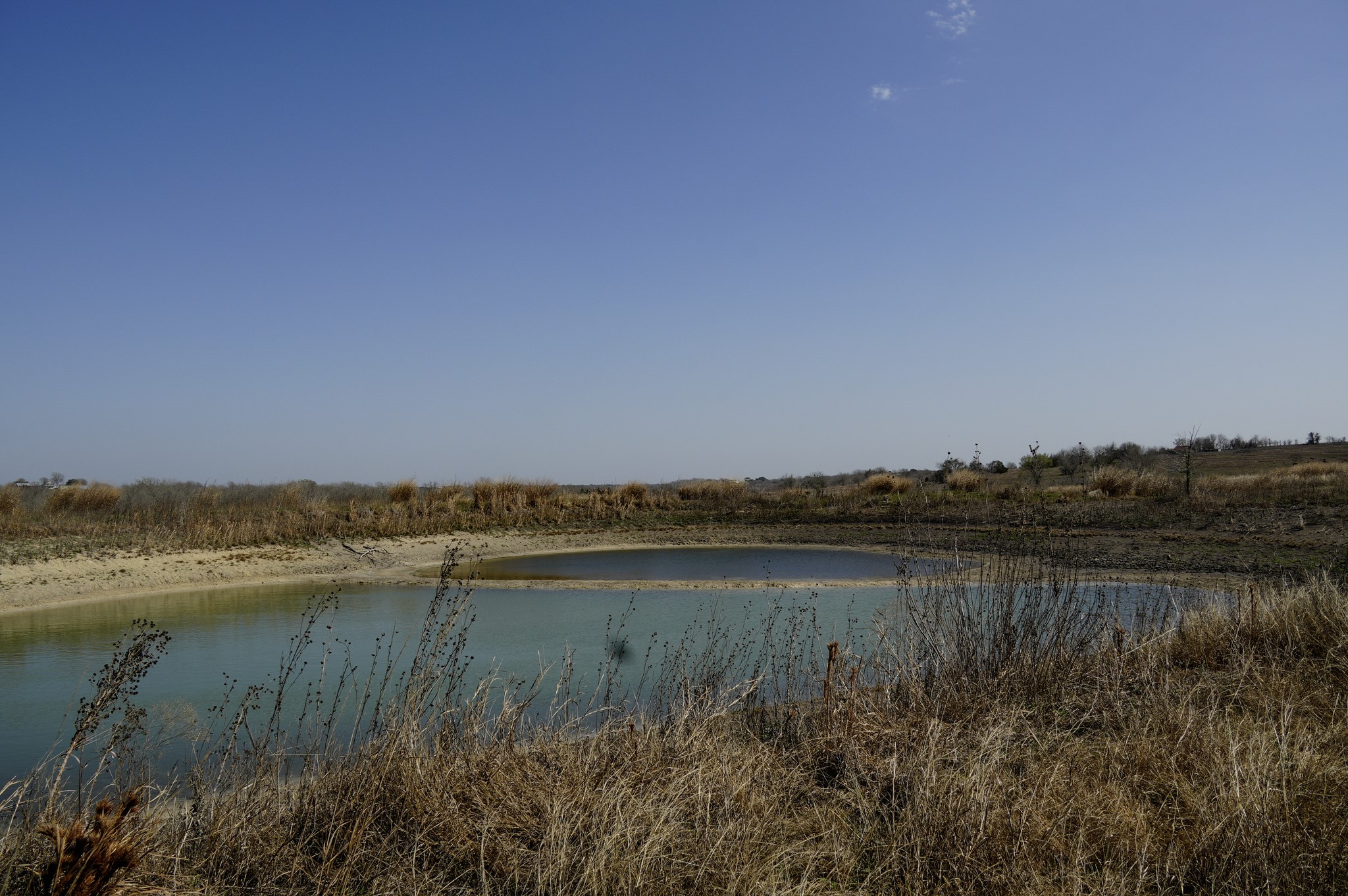 6455 Gebert Road Muldoon, TX 78949 - Photo 21 of 44 a view of a lake with houses in the back