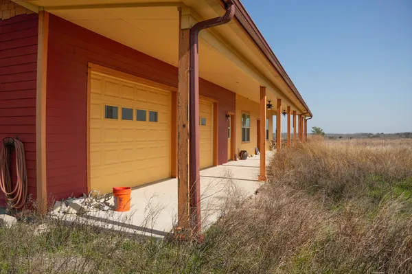 a view of house with a yard