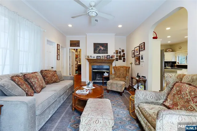 a living room with furniture fireplace and a flat screen tv