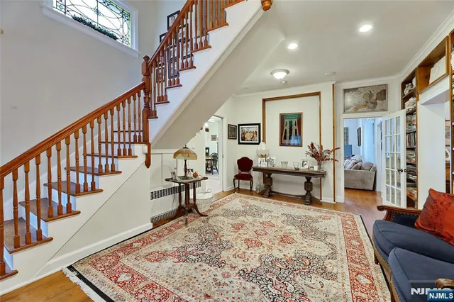 a living room with furniture and a rug