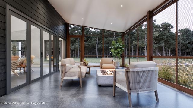 a outdoor space with patio couch and wooden floor