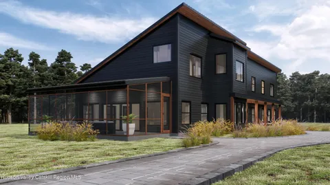 a view of a house with backyard and porch