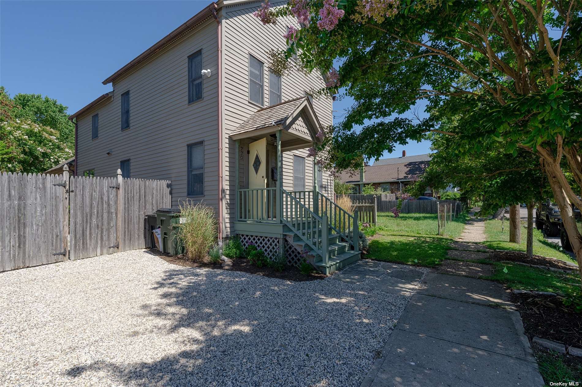 220 North Street Greenport, NY 11944 - Photo 1 of 1 a front view of a house with a garden