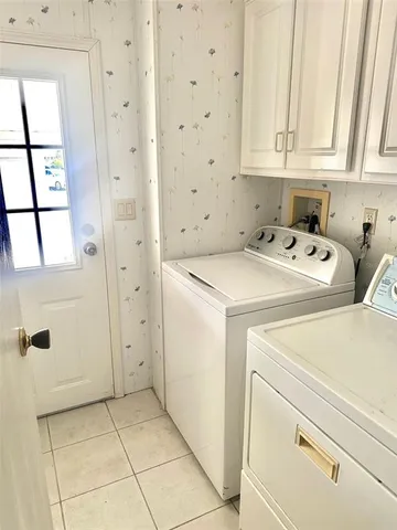 a view of storage and utility room with washer and dryer
